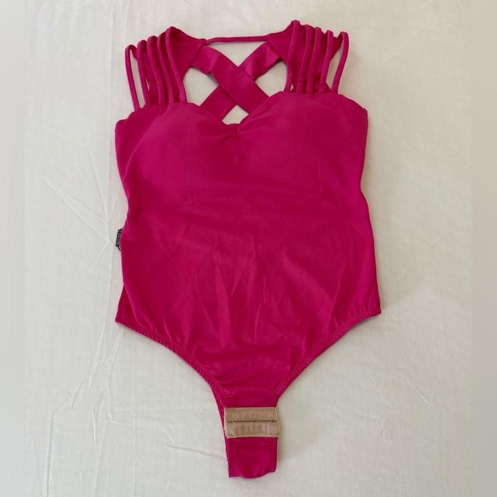 Carol Catugy hot pink bodysuit featuring a stylish criss-cross strappy back a...